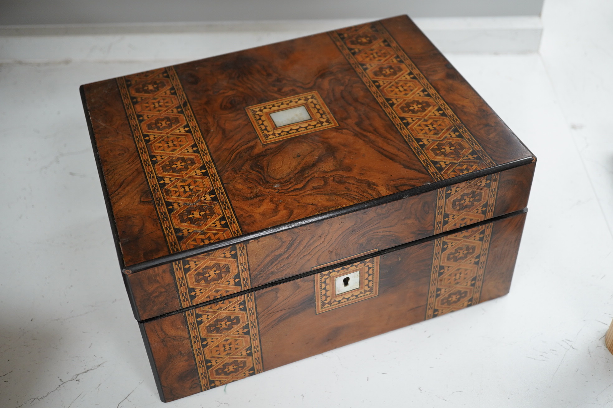 A mahogany brass mounted 19th century writing box and a walnut inlaid and mother of pearl writing box, brass mounted box, 35cm wide. Condition - exterior good, felt on slope torn.